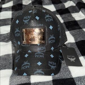 MCM Black Cap with Blue Accents and Gold Logo